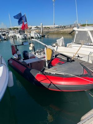 many boats docked in the water at the marina
