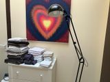 a lamp that is on top of a dresser in a room