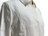 an image of a white jacket on a mannequin