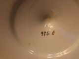 a close up view of a white plate with numbers on it