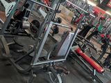 a large gym with a lot of machines in it