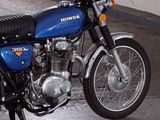 a blue motorcycle that is parked in a garage