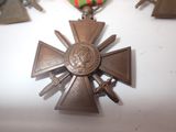 a medal with a cross and swords on it