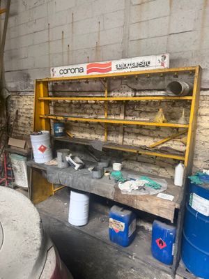 a workbench with a lot of tools on it in a garage