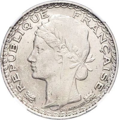 a close up of a coin with a woman ' s head on it