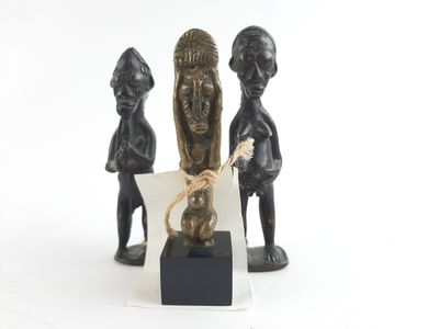 two figurines of a man and a woman with a cat
