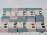several boxes of bedding are stacked on top of each other