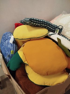 a cardboard box filled with stuffed toys and other items