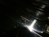 a close up of a pair of knives on top of a stove