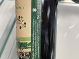 a bottle of wine that is sitting on a shelf
