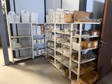 many boxes and boxes on the shelves in the room