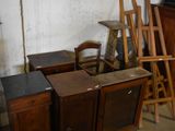 many pieces of furniture in a room with a white wall