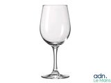 an empty wine glass sitting on top of a white table