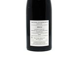 a bottle of wine that is sitting on a table