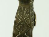 a close up of a metal object on a white surface