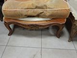 a chair that has a pillow on top of it