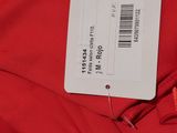 the label on a red jacket is attached to the back of the jacket