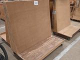 many pieces of furniture that are being assembled in a warehouse