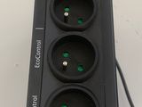 an image of a black power strip with three green lights