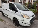 a white van that is parked on the side of the street
