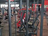 a gym with a lot of machines in it