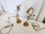 pair of antique brass candlesticks with flowers and leaves