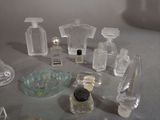 many different types of perfume bottles on a table