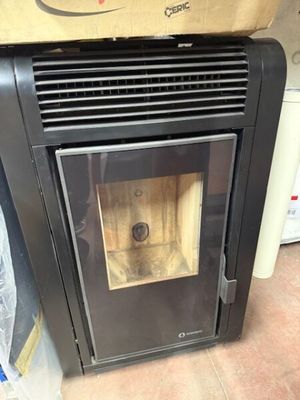 a black stove with a wood burning inside of it