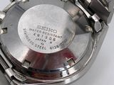 an image of a close up of a wrist watch on a white surface