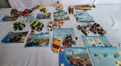 a lot of legos that are on a bed