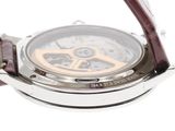 a close up of a wrist watch on a white surface