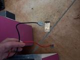 a person that is using a pair of scissors to cut a piece of paper