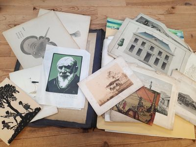 a pile of old books on a wooden table