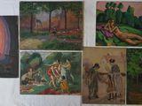 many paintings on the wall of this room