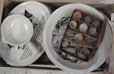 two cups and saucers in a box on the table