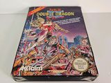 the box for the game double dragon is sitting on a table