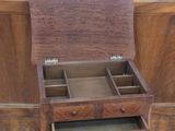 a small wooden table with a drawer on top of it