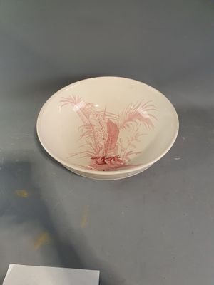 a plate with a picture of a palm tree on it