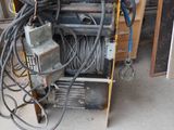 a pile of electrical equipment sitting in a garage