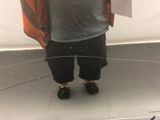 a man that is standing in front of a mirror