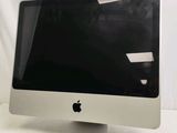 a computer monitor sitting on top of a white table