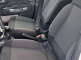 the interior of a car with black seats and a steering wheel