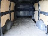 the inside of a van with the door open and the back of it ' s door open