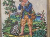 an image of a cross stitch picture of a boy with a dog