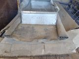 an image of a kitchen with a grill in the middle of it