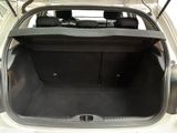 the back of a car with the trunk open and the seats folded down