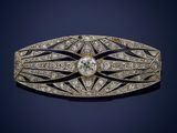 an art deco diamond and gold broochle