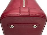 a close up of a red purse with a zipper on it