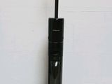 a vacuum that is sitting on the floor next to a wall