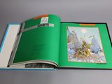 an open book with a picture of a man riding a horse